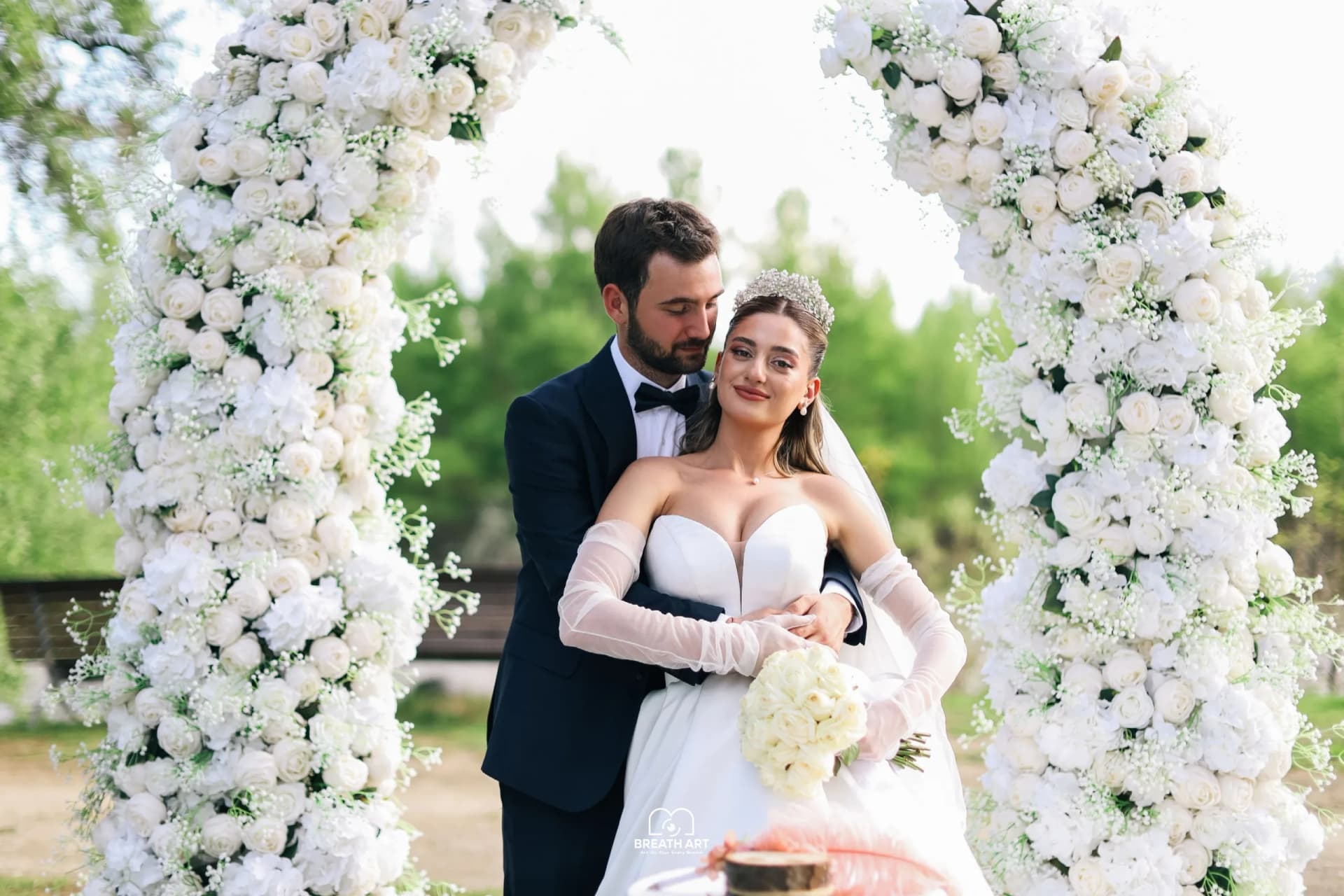 Couple under a floral arch